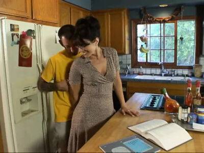 Lusty brunette milf in glasses seduced man next door on her kitchen counter on tubemilf.net