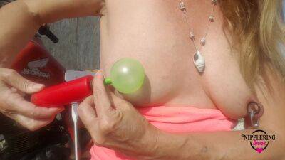 Nippleringlover Horny Milf Sticking Balloons Through Extreme Stretched Pierced Nipples Outdoors on tubemilf.net
