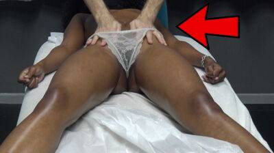 Masseur makes horny black milf massage the customer by pulling the lace underwear on her oiled pussy lips on tubemilf.net
